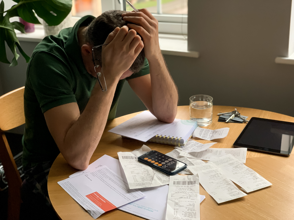 Man stressed over finances and poor credit